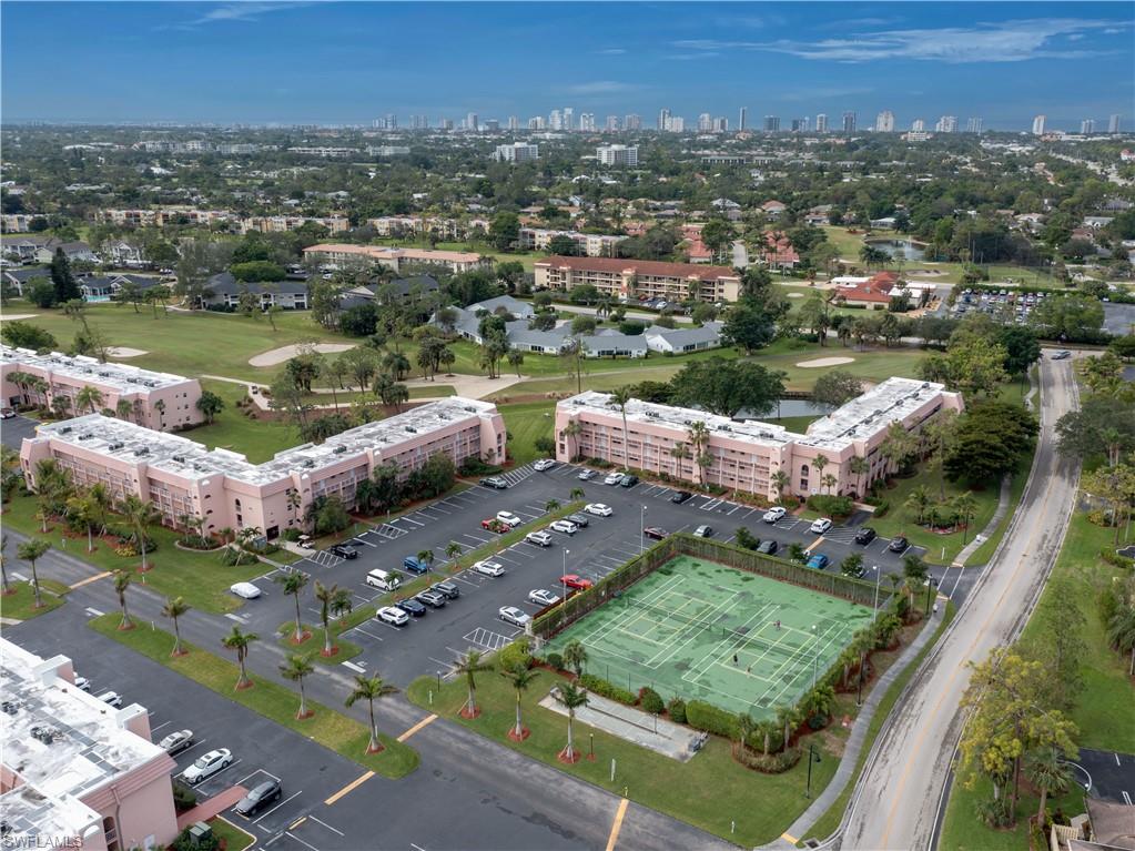 180 Turtle Lake Court, Unit 209 Naples, FL 34105 - Photo 12 of 12 an aerial view of a house with a lake view