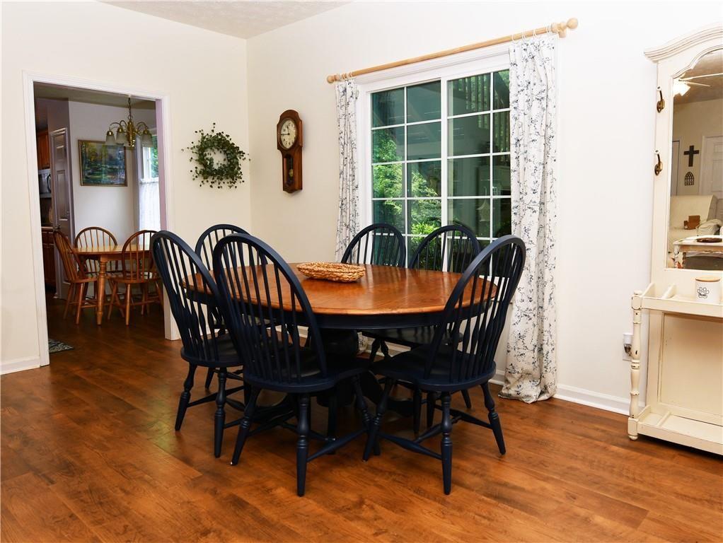 795 Sunset Ridge Lane Southeast Lawrenceville, GA 30045 - Photo 26 of 47 a dining room with furniture window and wooden floor