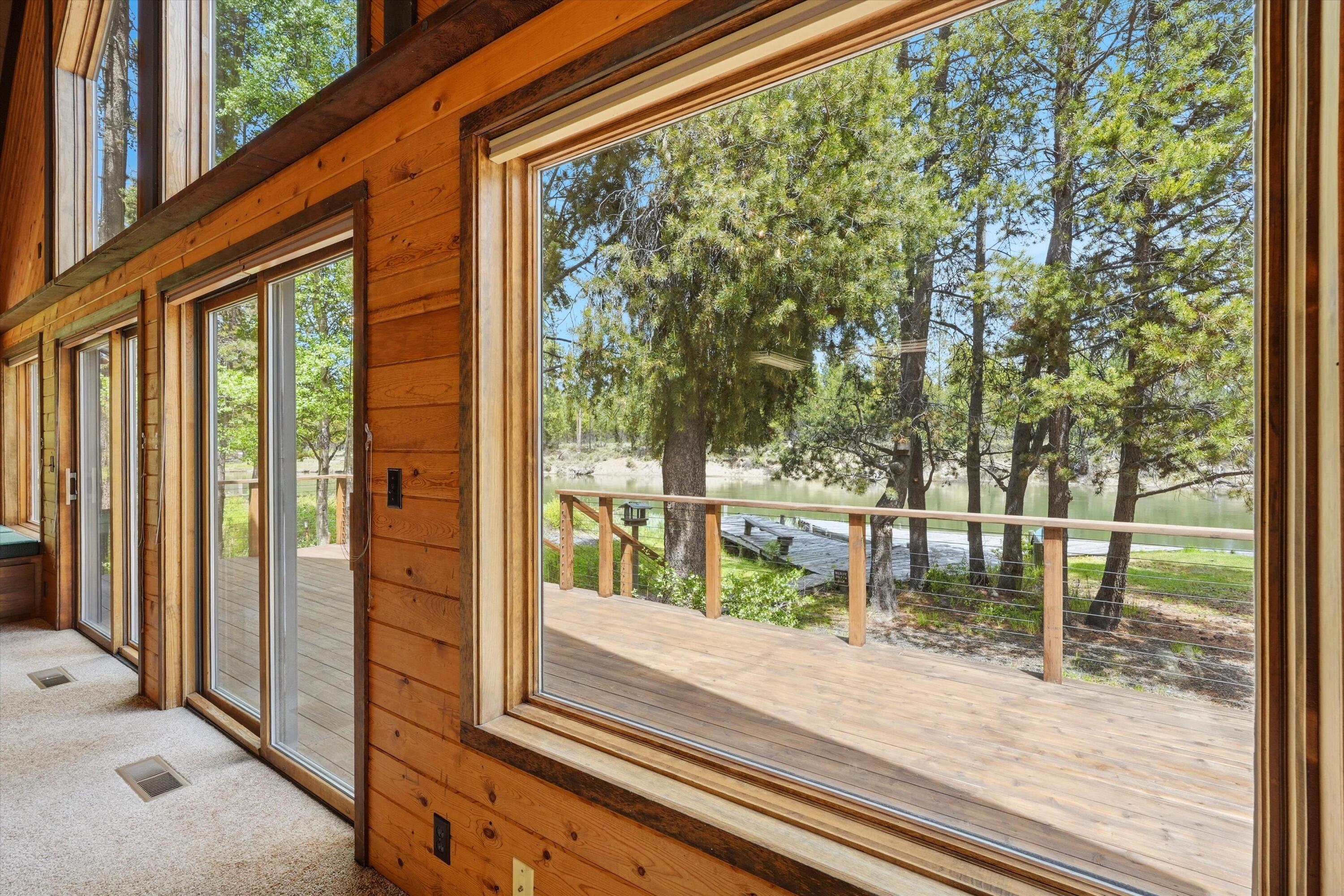 56446 Eclipse Drive Bend, OR 97707 - Photo 20 of 42 a porch with a bench next to a yard