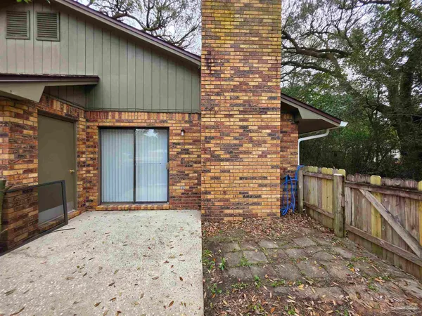 a brick house with a large door