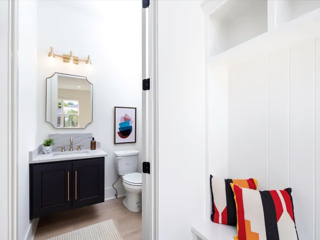 a living room with furniture a fireplace and a table