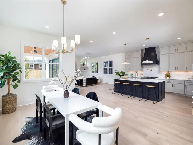 a kitchen with a sink a window and cabinets