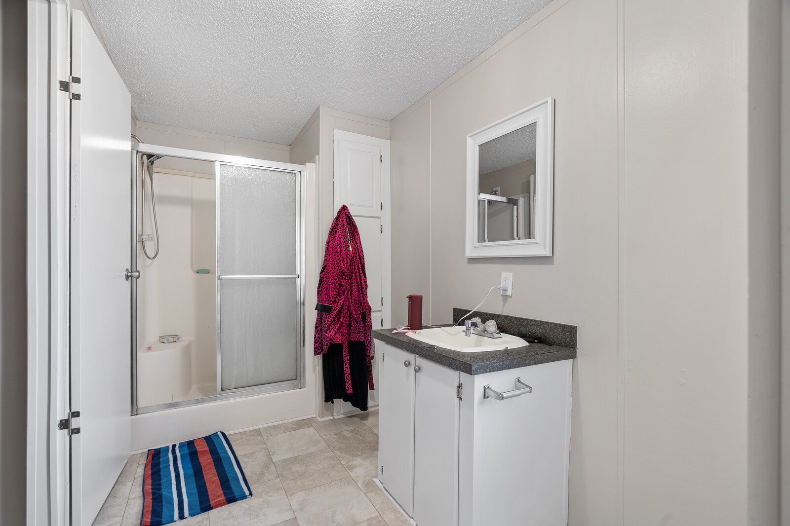 3853 Atkins Road Cedar Hill, TN 37032 - Photo 14 of 22 a view of walk in closet with clothes and shoes