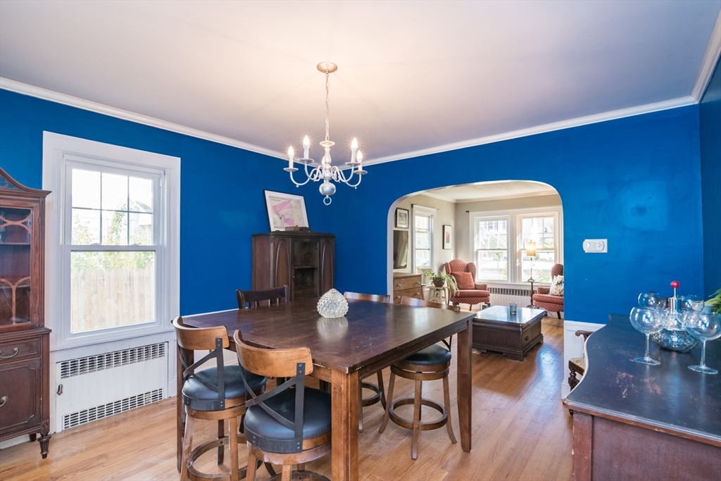 28 Rencelau Street Springfield, MA 01118 - Photo 11 of 34 a view of a dining room with furniture a chandelier and wooden floor