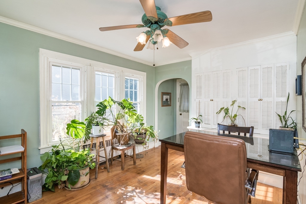 28 Rencelau Street Springfield, MA 01118 - Photo 12 of 34 a living room with furniture potted plant and a chandelier