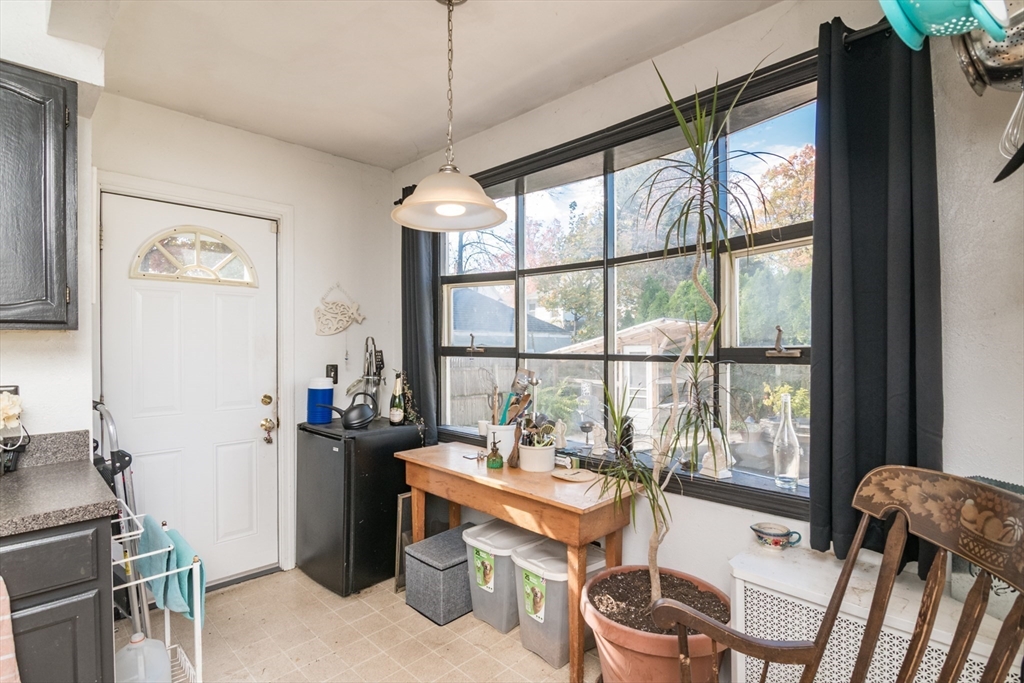 28 Rencelau Street Springfield, MA 01118 - Photo 19 of 34 a view of a workspace with furniture and a window