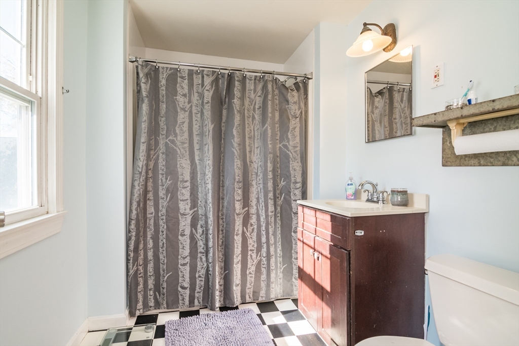 28 Rencelau Street Springfield, MA 01118 - Photo 21 of 34 a view of a bathroom with a sink and a window