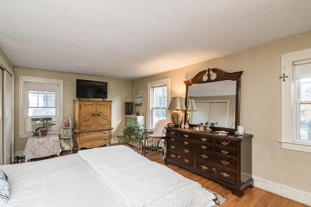 28 Rencelau Street Springfield, MA 01118 - Photo 23 of 34 a bedroom with a bed and a dresser