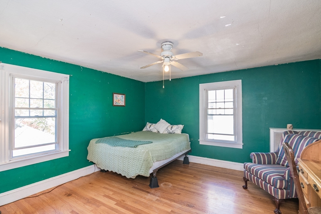28 Rencelau Street Springfield, MA 01118 - Photo 25 of 34 a bedroom with a bed and a couch