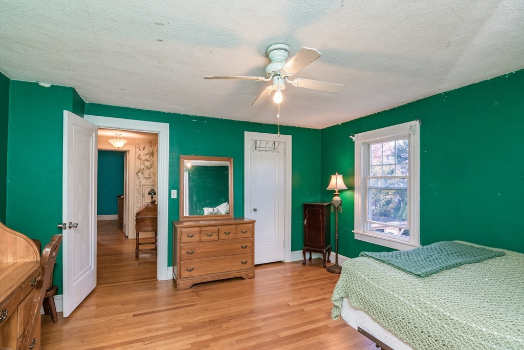 28 Rencelau Street Springfield, MA 01118 - Photo 26 of 34 a bedroom with a bed and a chandelier