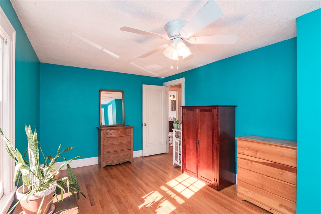 28 Rencelau Street Springfield, MA 01118 - Photo 28 of 34 a view of a livingroom with a chandelier fan and a kitchen