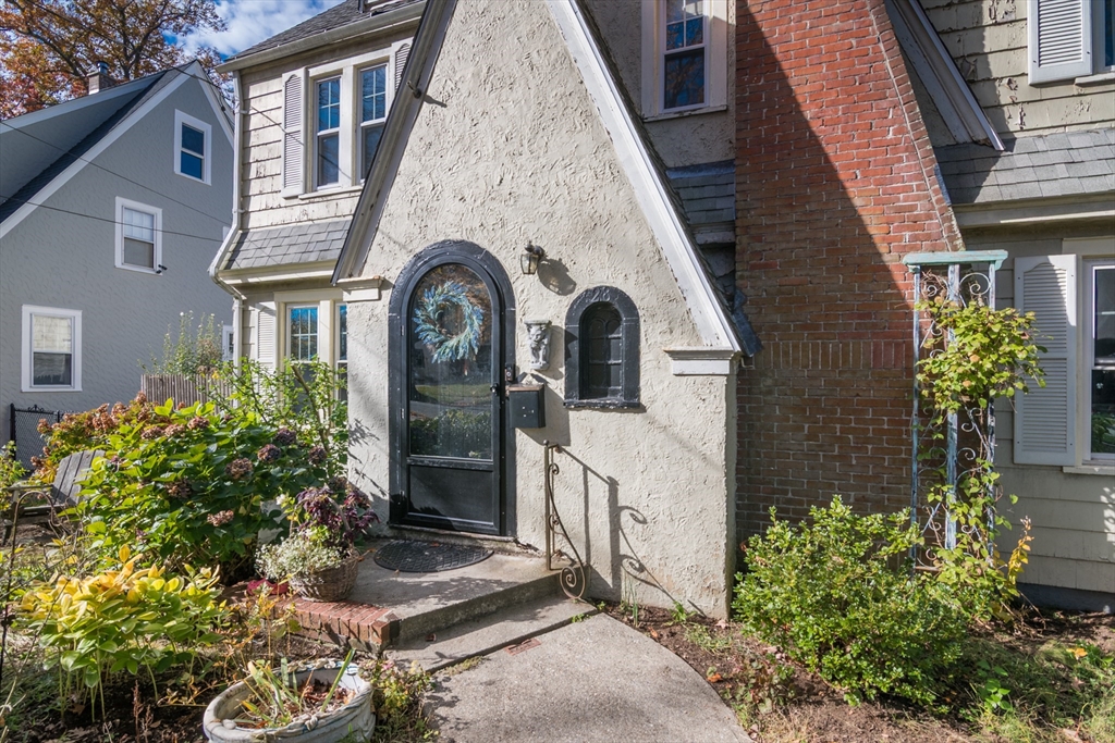 28 Rencelau Street Springfield, MA 01118 - Photo 3 of 34 a view of a brick house with a flower plants