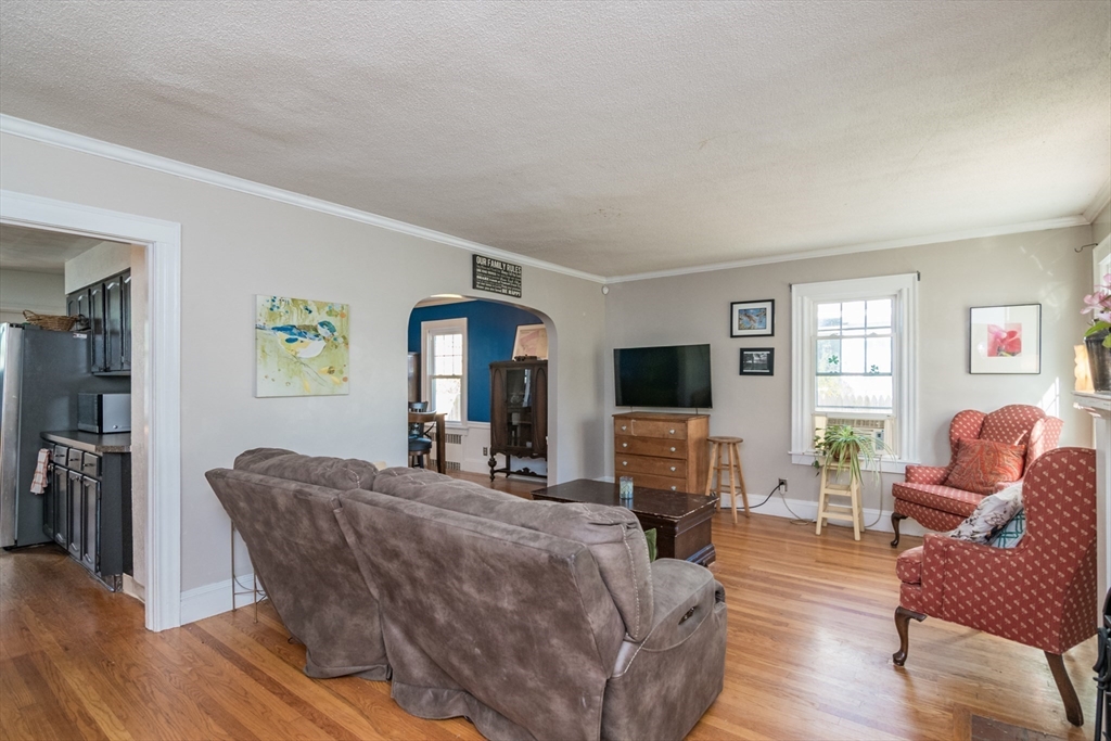 28 Rencelau Street Springfield, MA 01118 - Photo 6 of 34 a living room with furniture and a flat screen tv