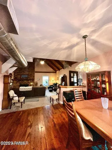 a outdoor kitchen with granite countertop lots of appliances