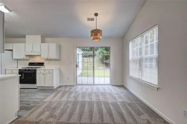 a view of a kitchen with microwave and stove