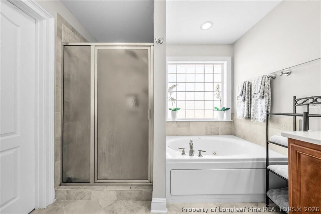 2708 Plum Ridge Road Fayetteville, NC 28306 - Photo 17 of 27 a bathroom with a bathtub and shower