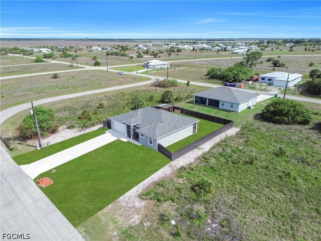 384 Neighborly Road LaBelle, FL 33935 - Photo 43 of 45 an aerial view of a residential houses with outdoor space and city view