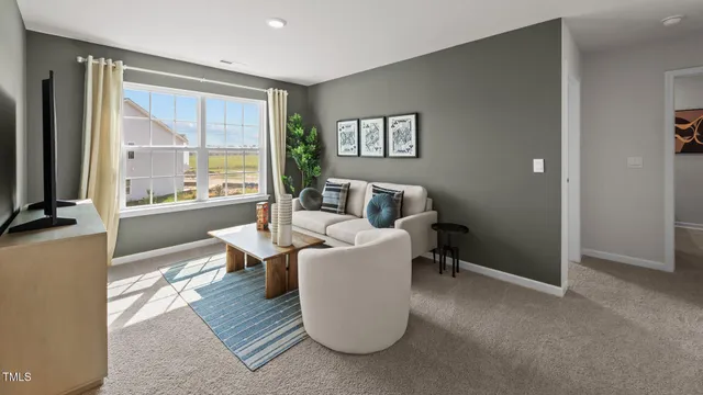 a bedroom with a bed and a potted plant