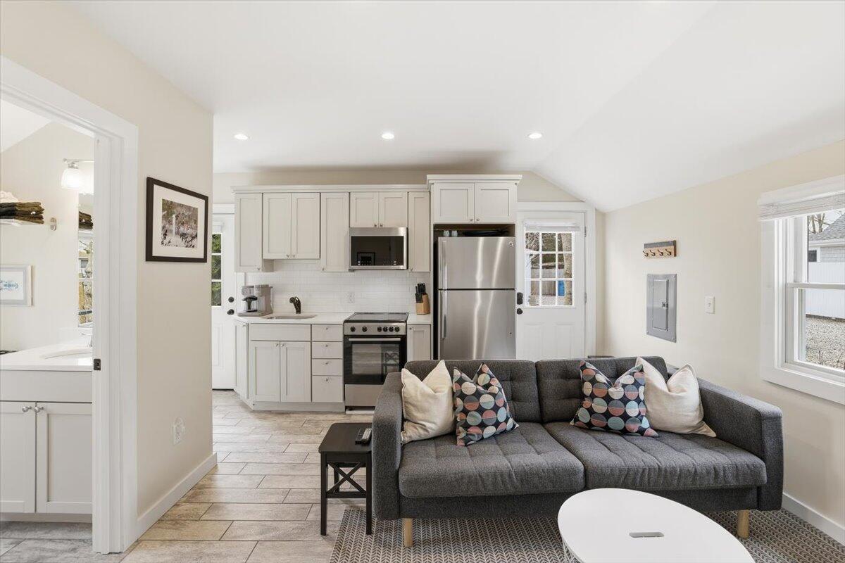 20 Nye Road, Unit 2026 Falmouth, MA 02540 - Photo 38 of 72 a living room with furniture white walls and white appliances