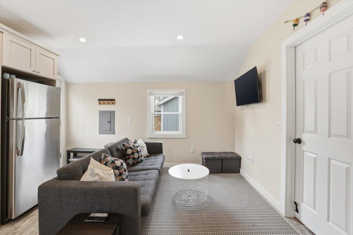 20 Nye Road, Unit 2026 Falmouth, MA 02540 - Photo 40 of 72 a living room with furniture and a flat screen tv