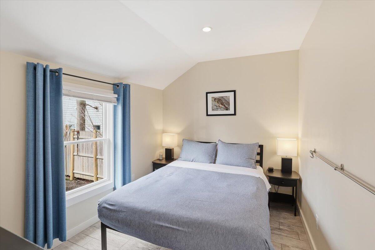 20 Nye Road, Unit 2026 Falmouth, MA 02540 - Photo 43 of 72 a bedroom with a large bed and a window