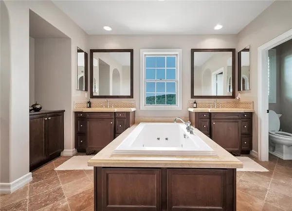 a kitchen with a sink stove and refrigerator