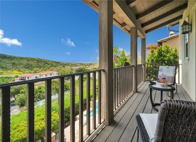 a view of two chairs in balcony