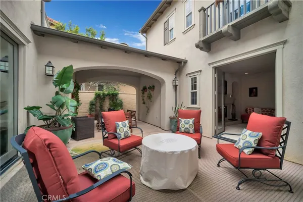 a outdoor living space with furniture and a potted plant
