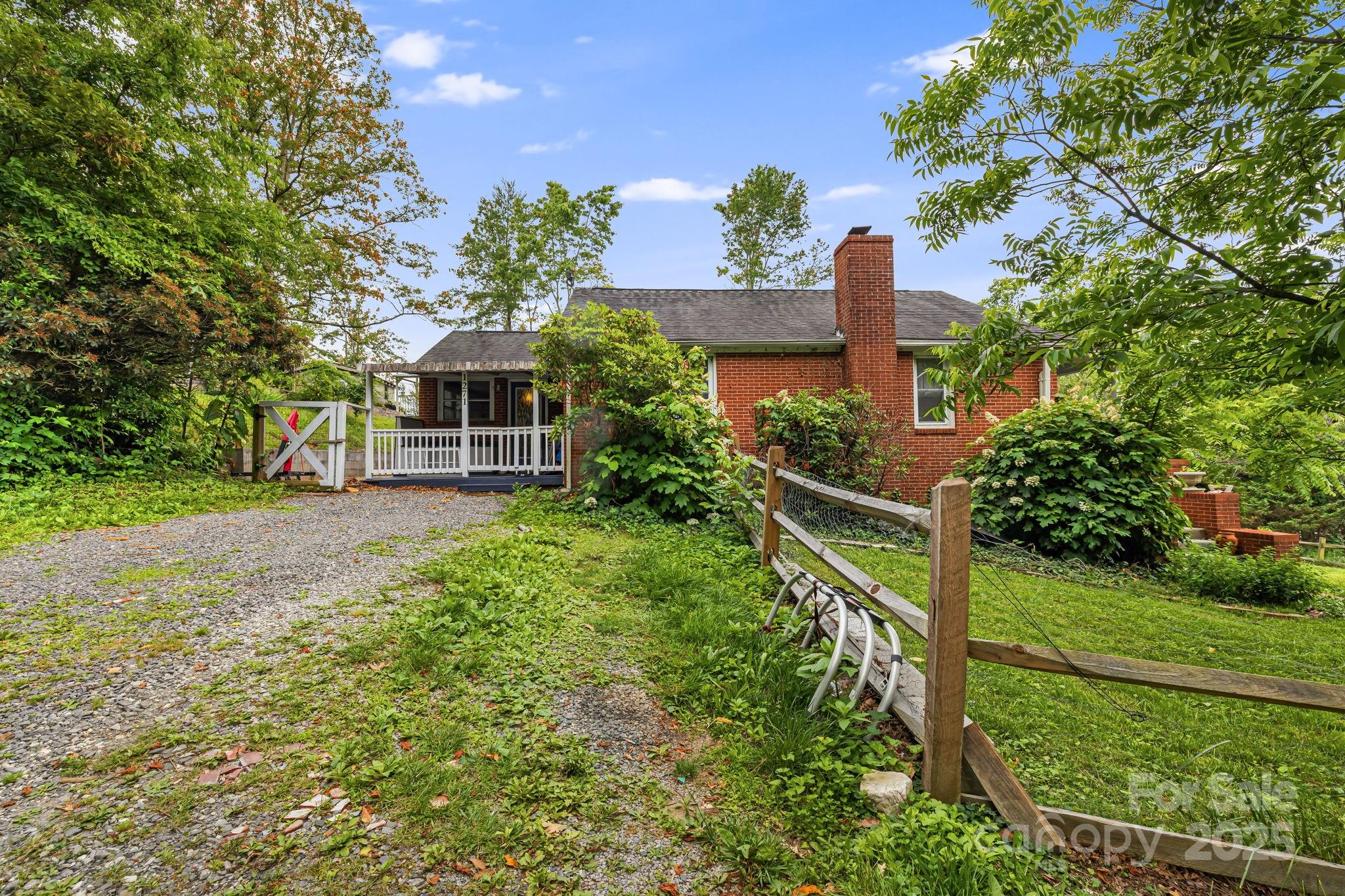 1271 Upper Brush Creek Road Fairview, NC 28730 - Photo 1 of 36 a view of house with a yard
