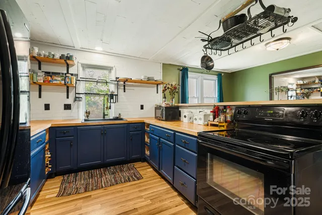 a kitchen with wooden cabinets and appliances
