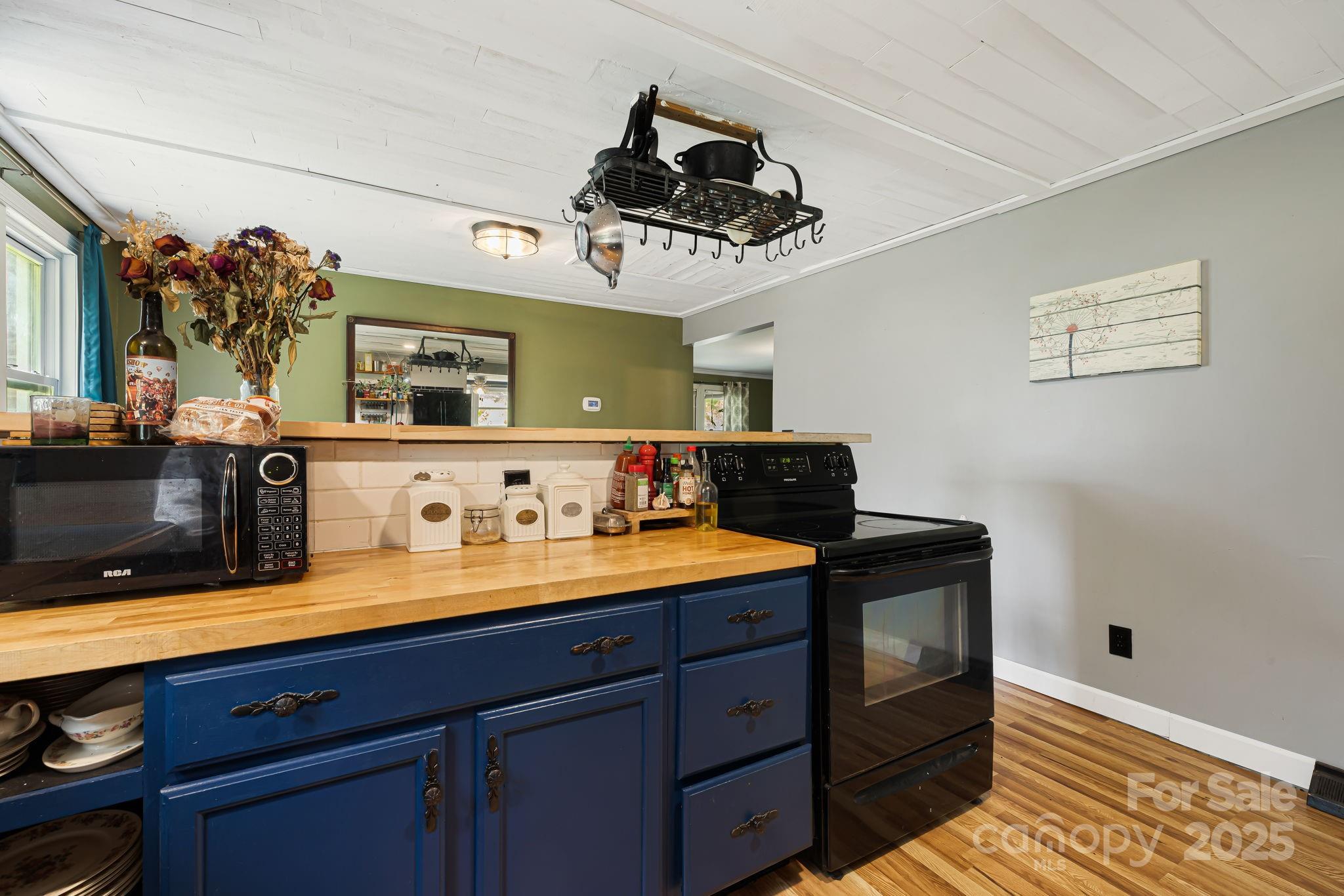 1271 Upper Brush Creek Road Fairview, NC 28730 - Photo 14 of 36 a kitchen with a sink and cabinets