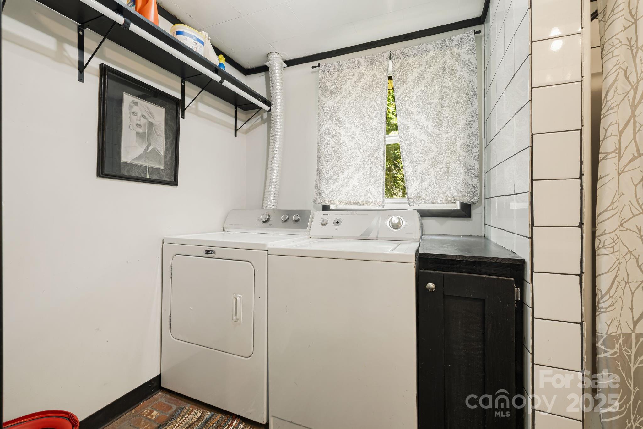 1271 Upper Brush Creek Road Fairview, NC 28730 - Photo 19 of 36 a bathroom with a sink and mirror