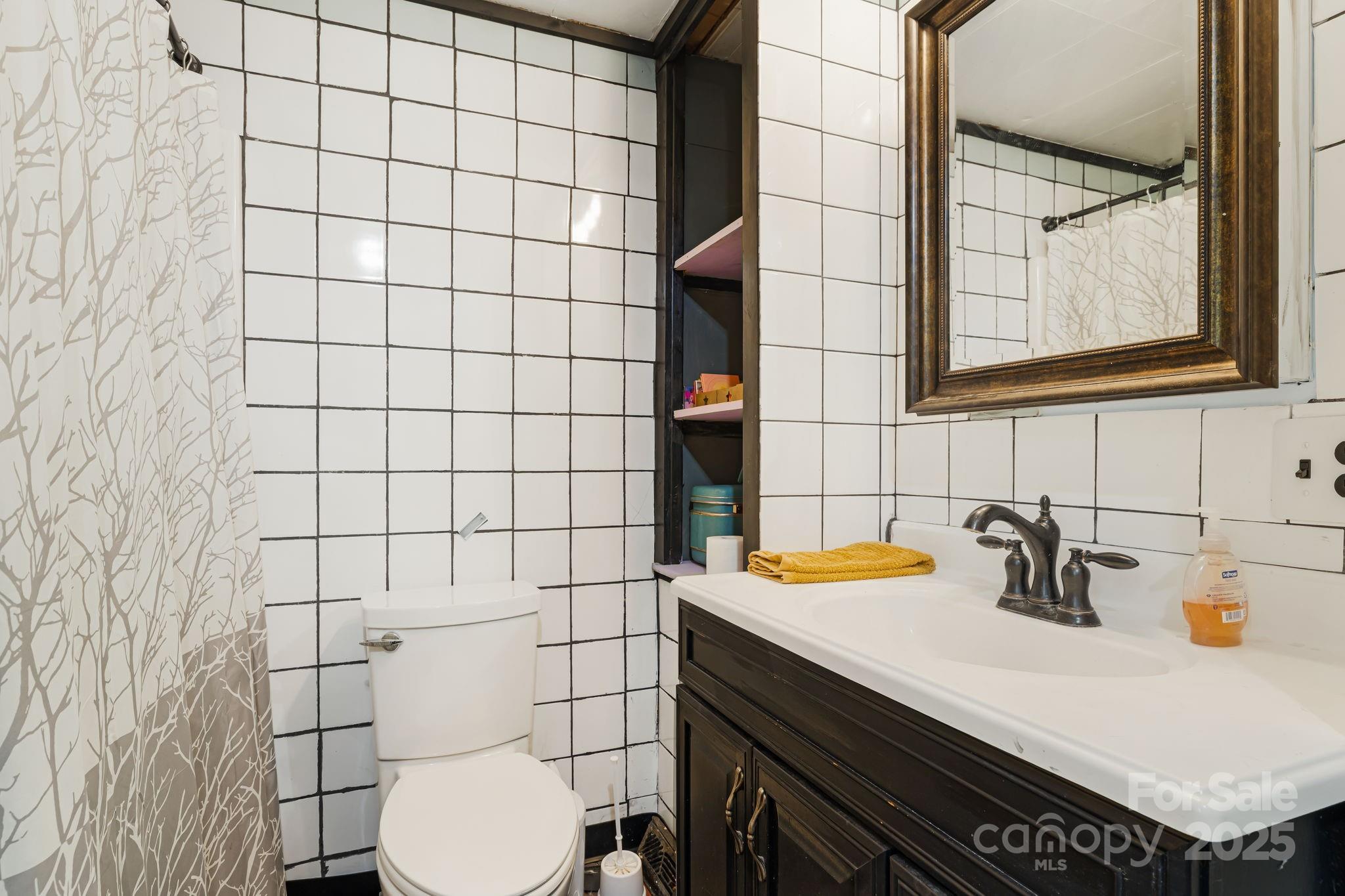 1271 Upper Brush Creek Road Fairview, NC 28730 - Photo 20 of 36 a bathroom with a sink and a toilet
