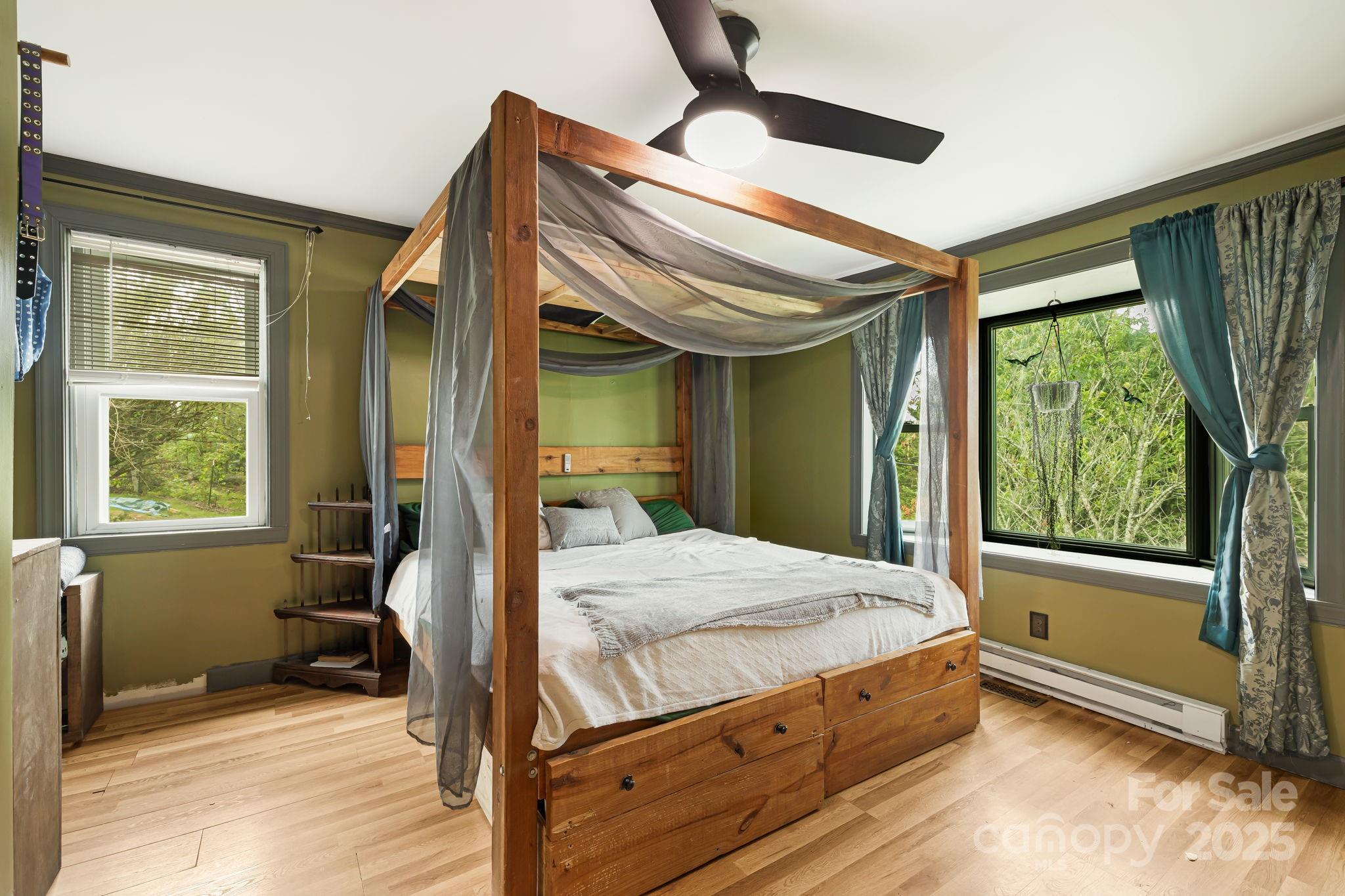 1271 Upper Brush Creek Road Fairview, NC 28730 - Photo 24 of 36 a bedroom with a bed and a window