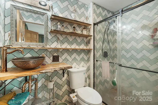 a bathroom with a sink and mirror