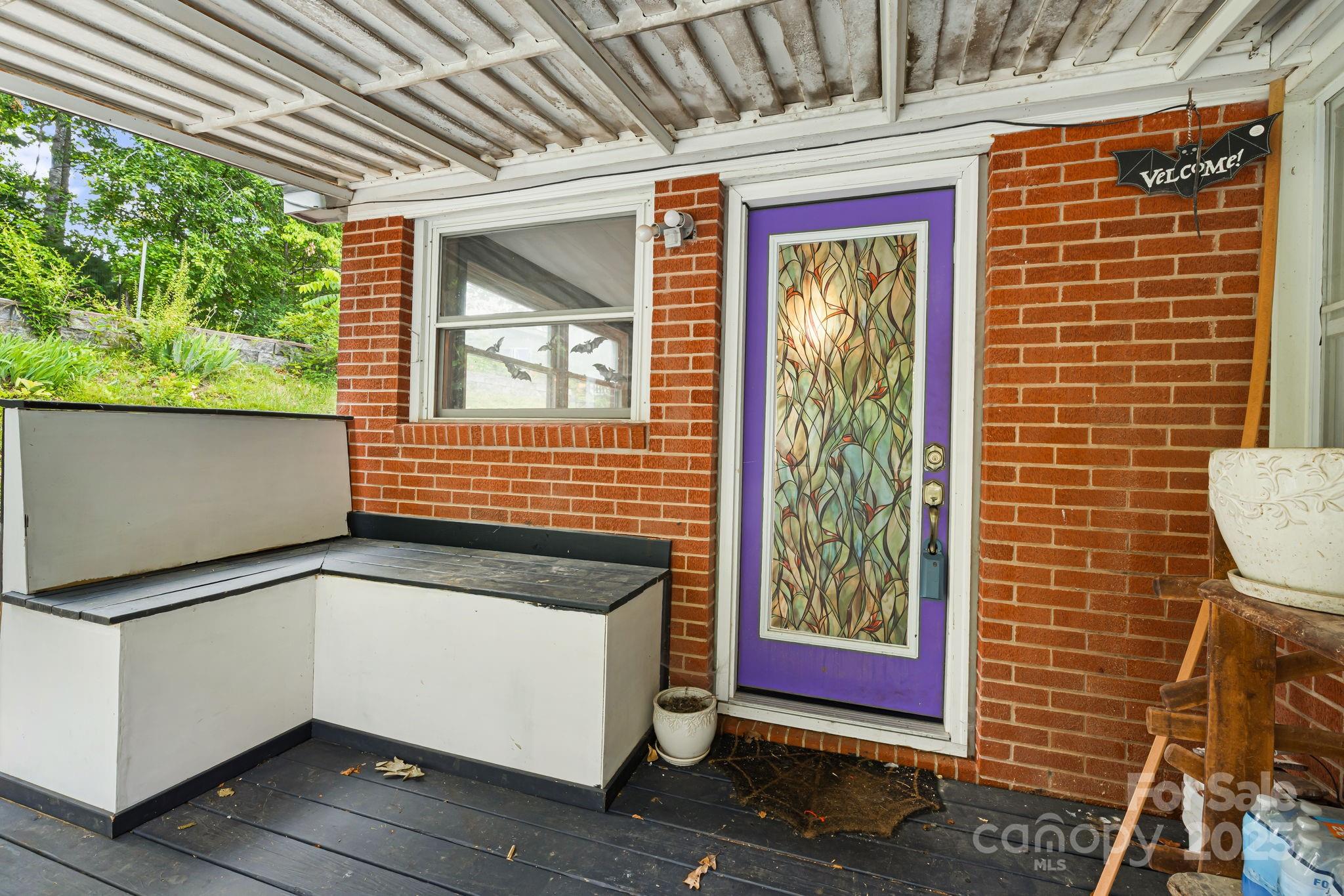 1271 Upper Brush Creek Road Fairview, NC 28730 - Photo 28 of 36 a view of front door of house with outdoor space