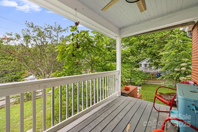 a view of a two chairs in the balcony