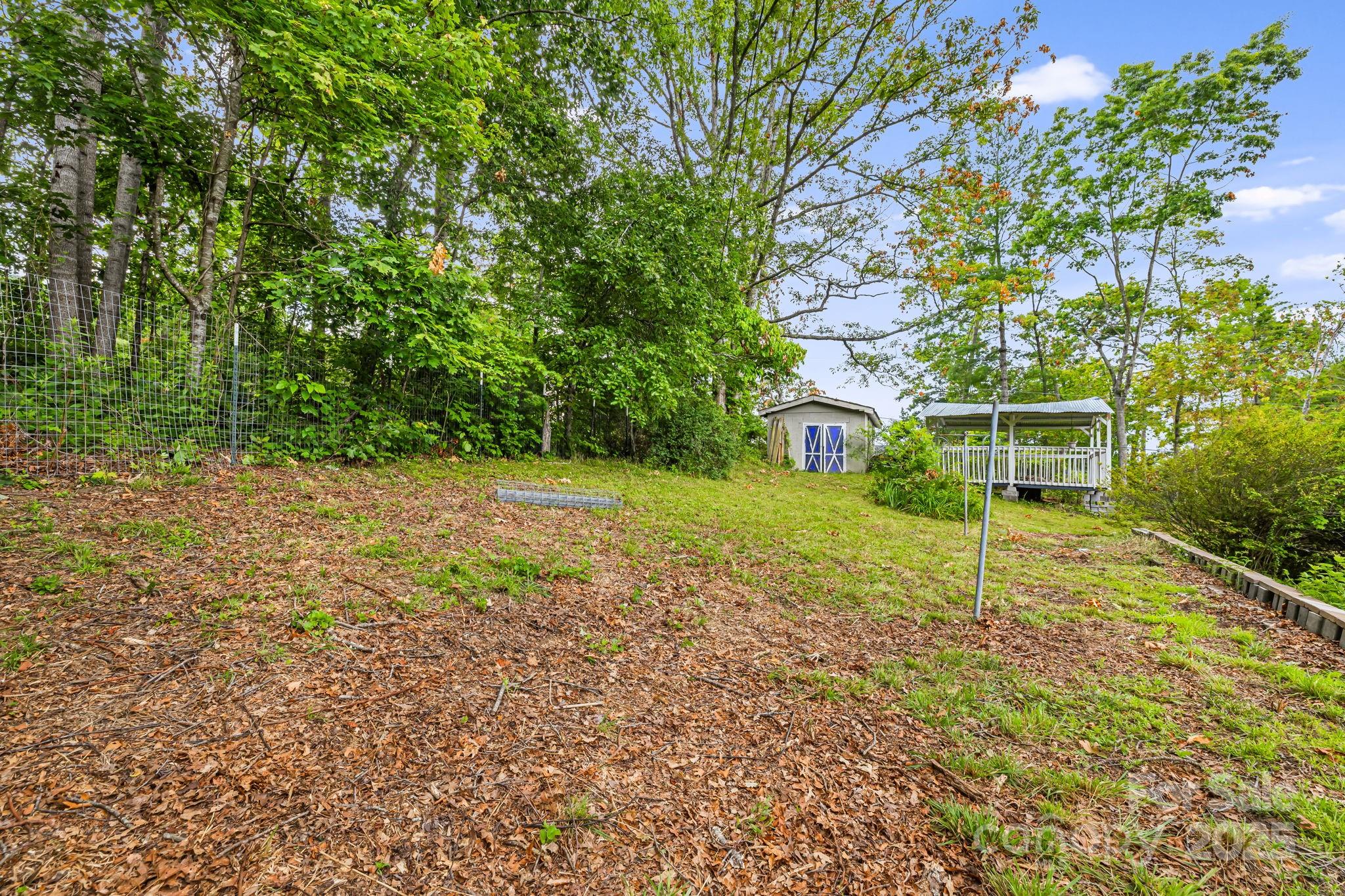 1271 Upper Brush Creek Road Fairview, NC 28730 - Photo 34 of 36 a view of a house with a yard