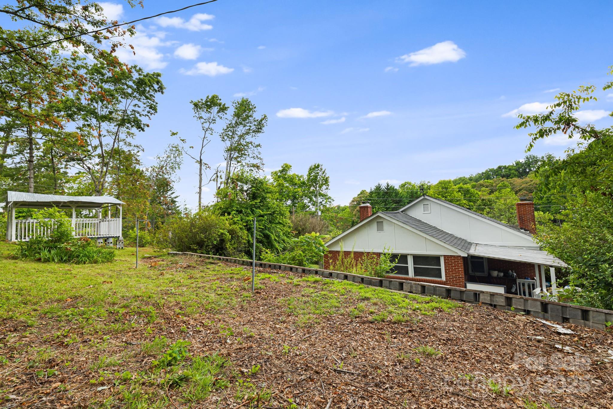 1271 Upper Brush Creek Road Fairview, NC 28730 - Photo 36 of 36 a front view of a house with garden