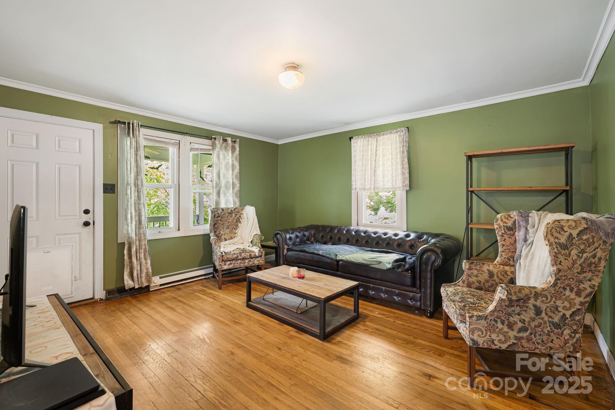 1271 Upper Brush Creek Road Fairview, NC 28730 - Photo 7 of 36 a living room with furniture rug and window