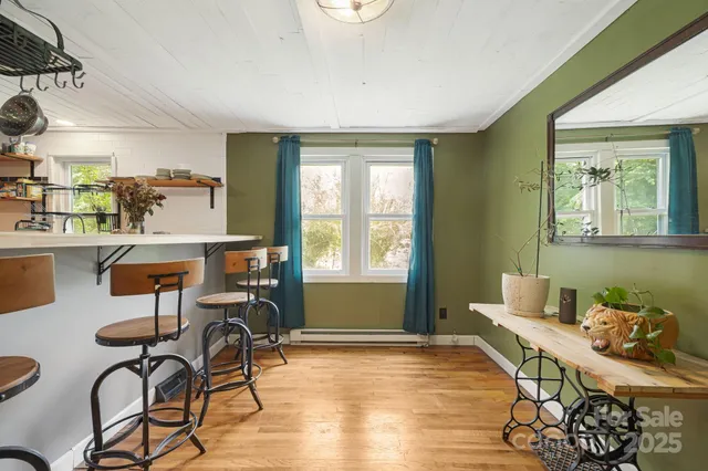 a workspace with furniture hardwood and a window
