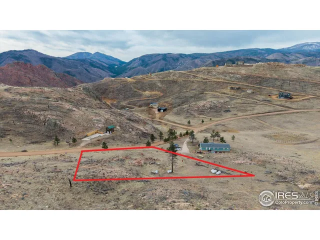 a bird view of a house with a mountain