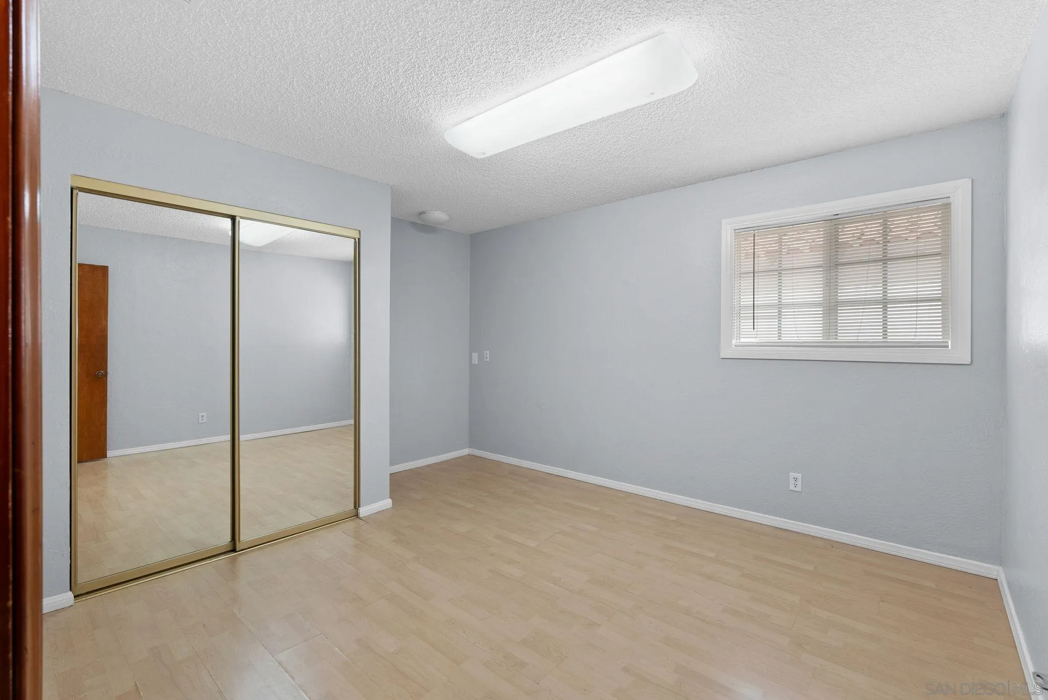 31162 Old River Road Bonsall, CA 92003 - Photo 13 of 44 an empty room with windows and closet