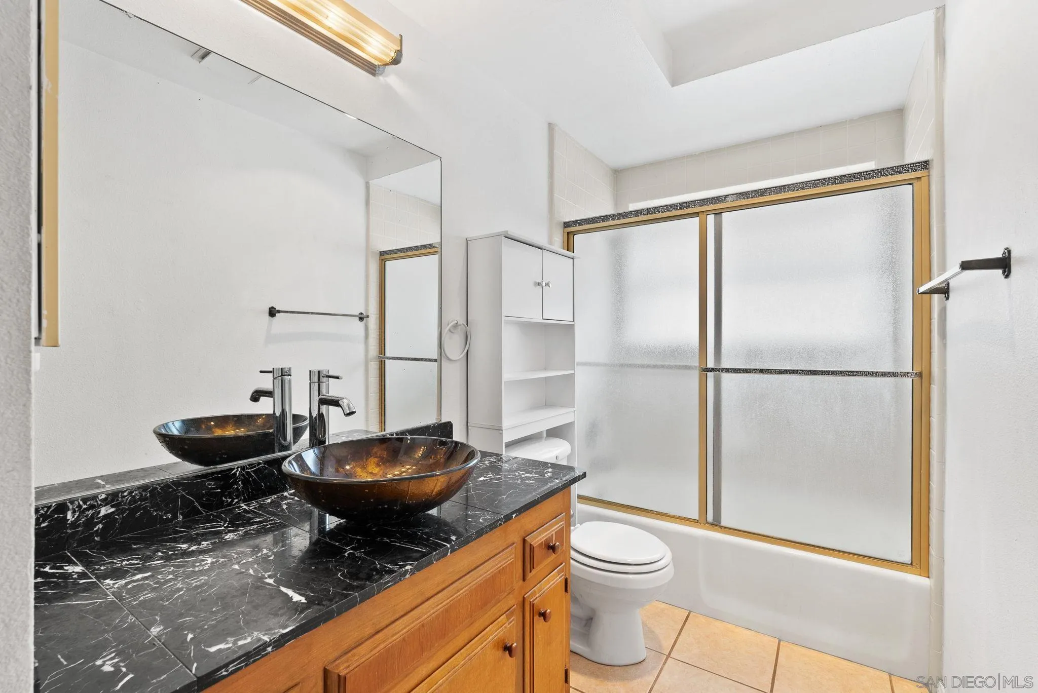 31162 Old River Road Bonsall, CA 92003 - Photo 15 of 44 a bathroom with a granite countertop sink toilet and shower