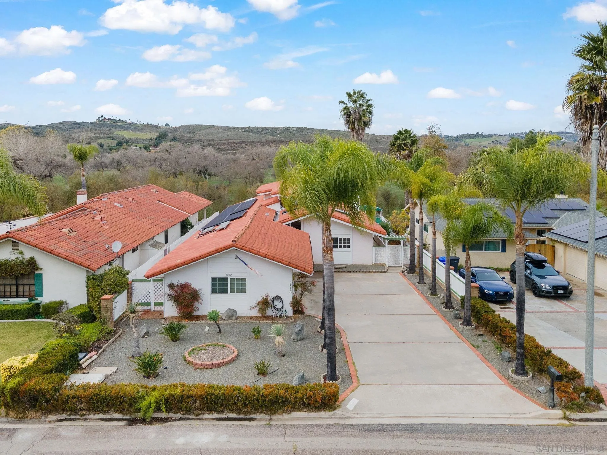 31162 Old River Road Bonsall, CA 92003 - Photo 2 of 44 a view of a house with a yard