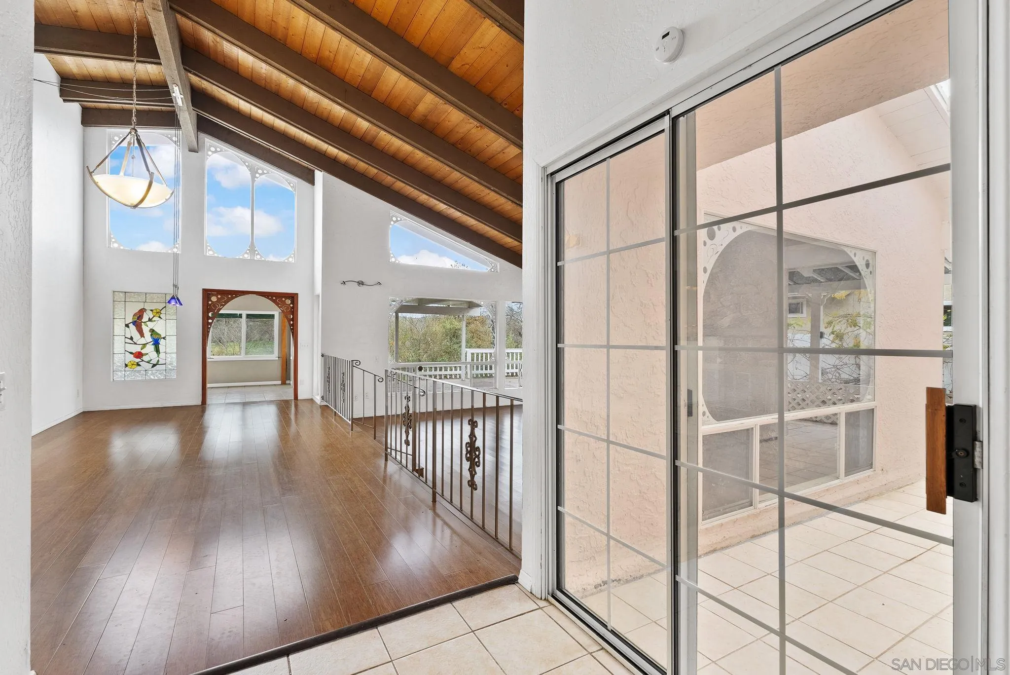 31162 Old River Road Bonsall, CA 92003 - Photo 23 of 44 a view of interior space with wooden floor and windows