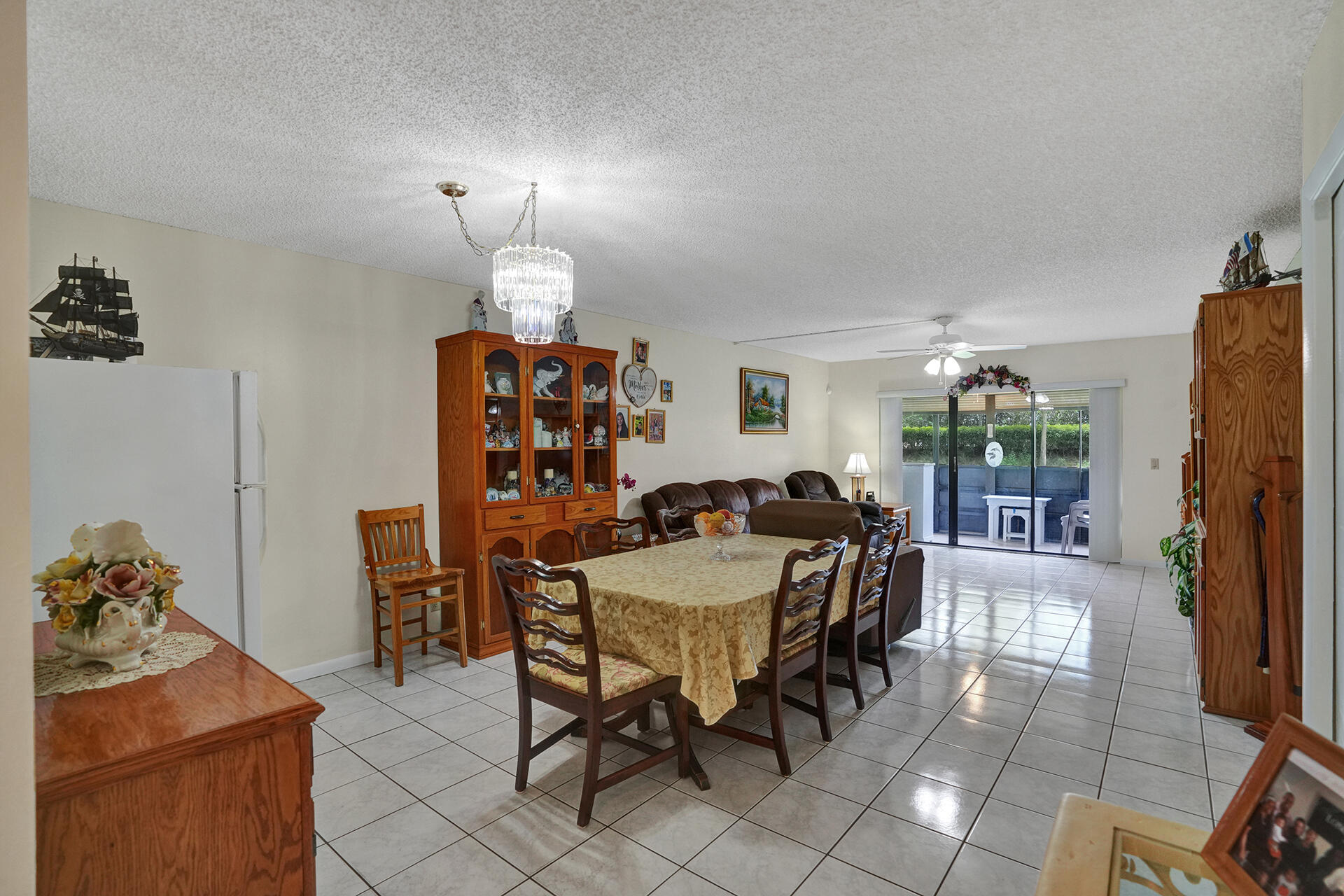 300 Racquet Club Road, Unit 103 Weston, FL 33326 - Photo 12 of 31 a view of a dining room with furniture window and outside view