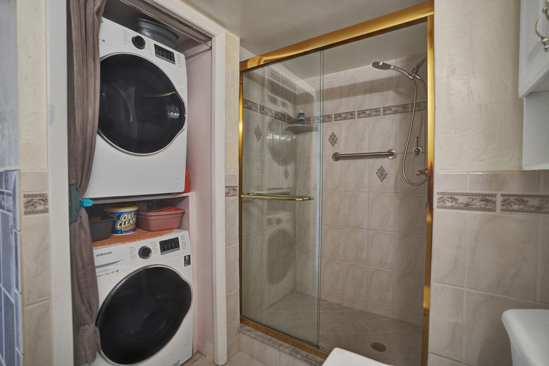 300 Racquet Club Road, Unit 103 Weston, FL 33326 - Photo 17 of 31 a utility room with dryer and washer