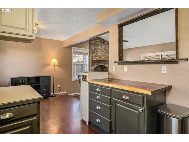 a view of room with window and wooden floor