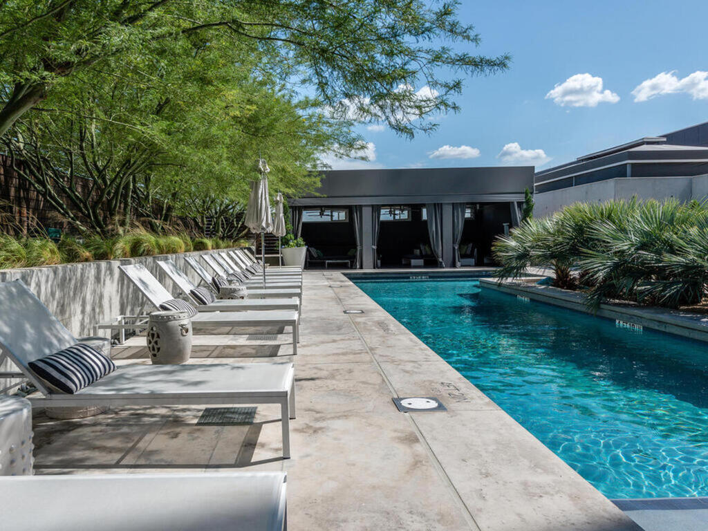 210 Lavaca Street, Unit 2809 Austin, TX 78701 - Photo 17 of 17 Lounge poolside at this urban oasis, complete with private cabanas and lush landscaping.